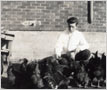 Charlie Evans Tending Chickens