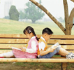 Children reading on bench