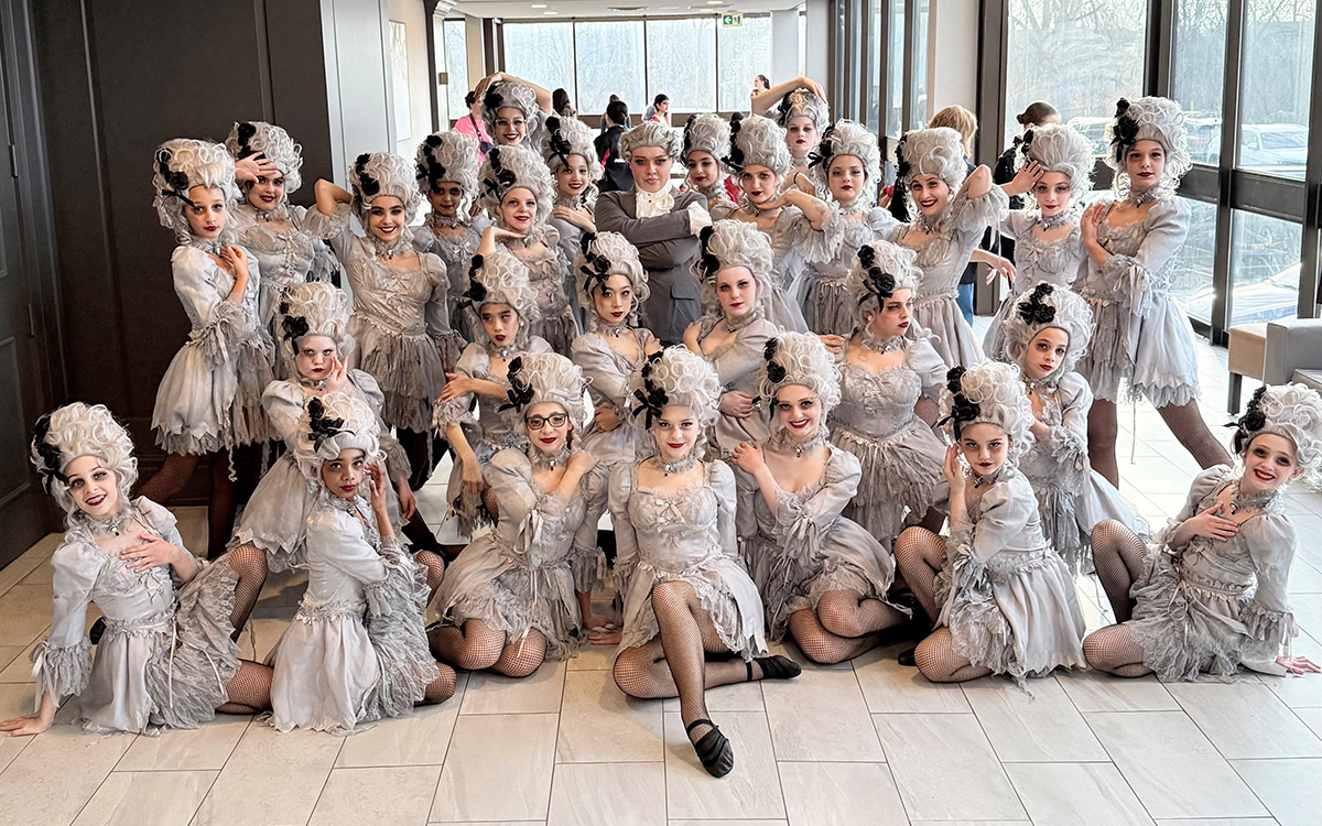 Dancers from Artistic Edge Dance Company in costumes 