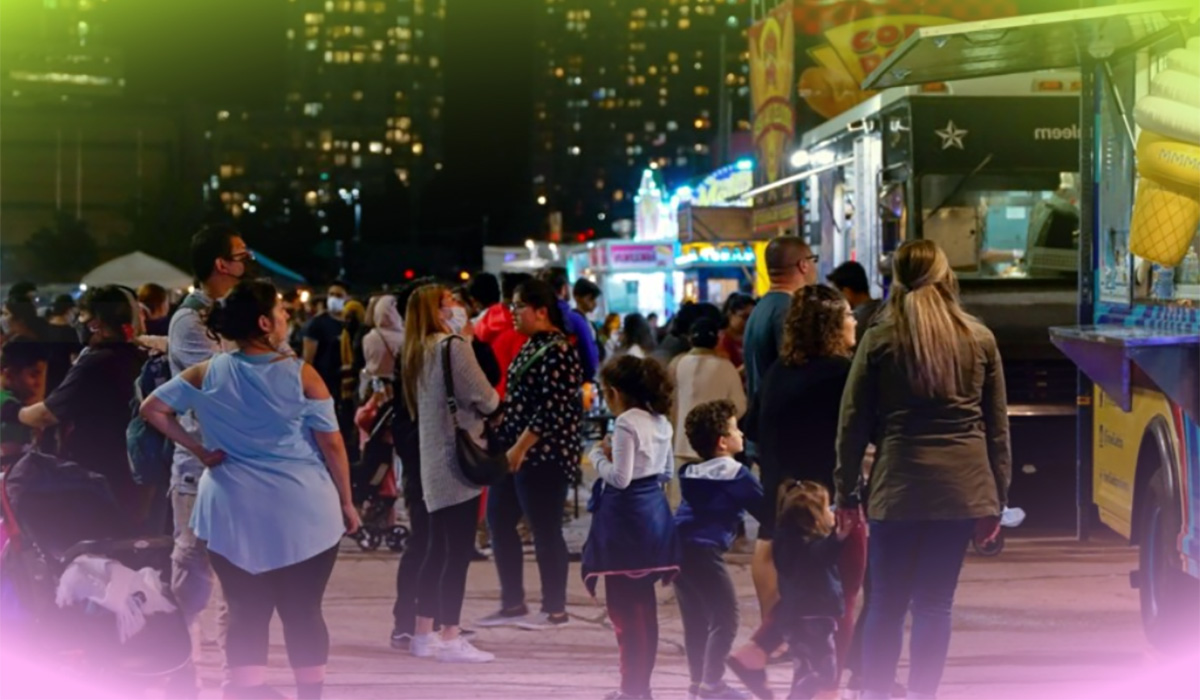 Festival attendees at a food truck