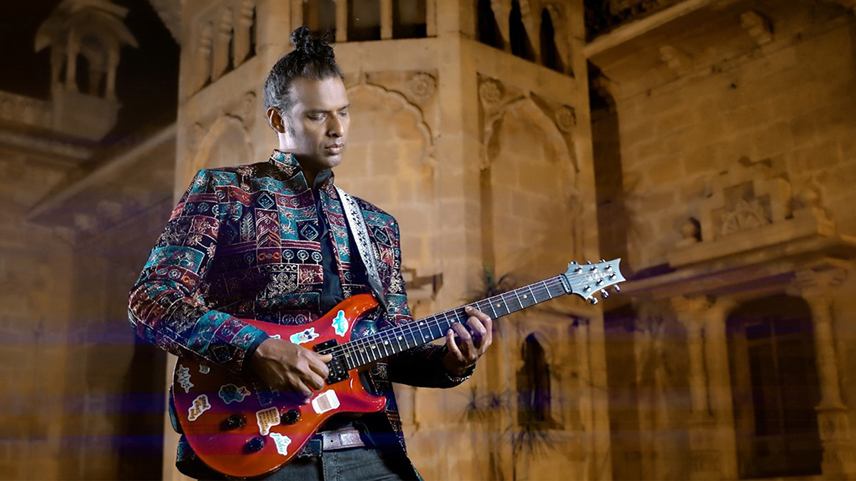 Musician Shallum X playing a guitar 