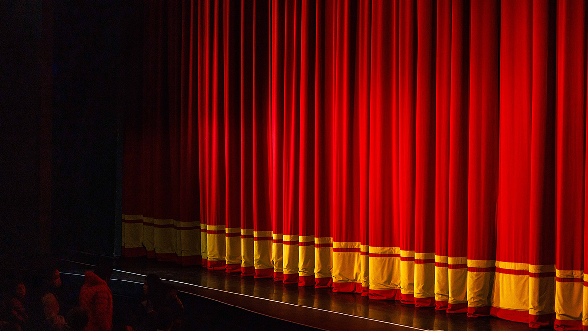 A closed red stage curtain