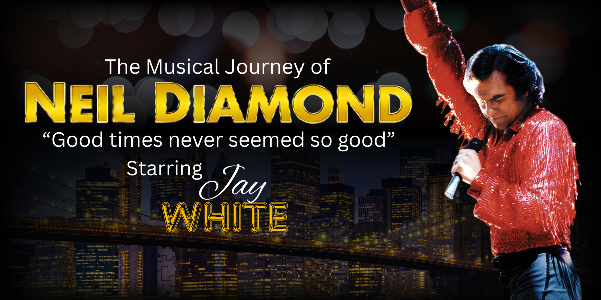 Jay White performing on stage as Neil Diamond.