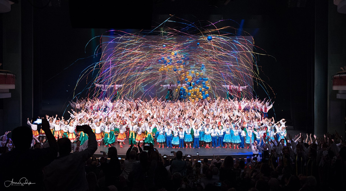 A large group of dancers on stage