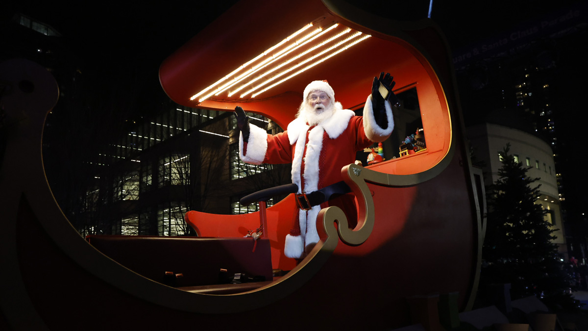 Santa Claus waving on a parade float