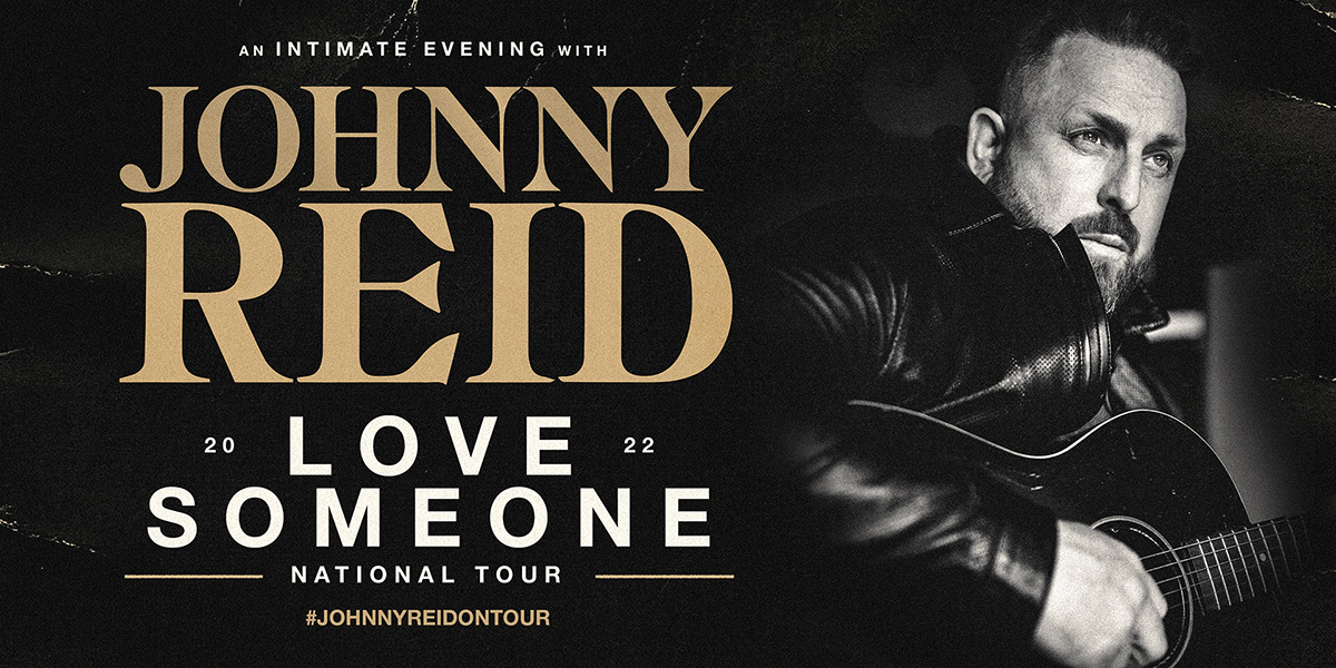 Johnny Reid playing the guitar.