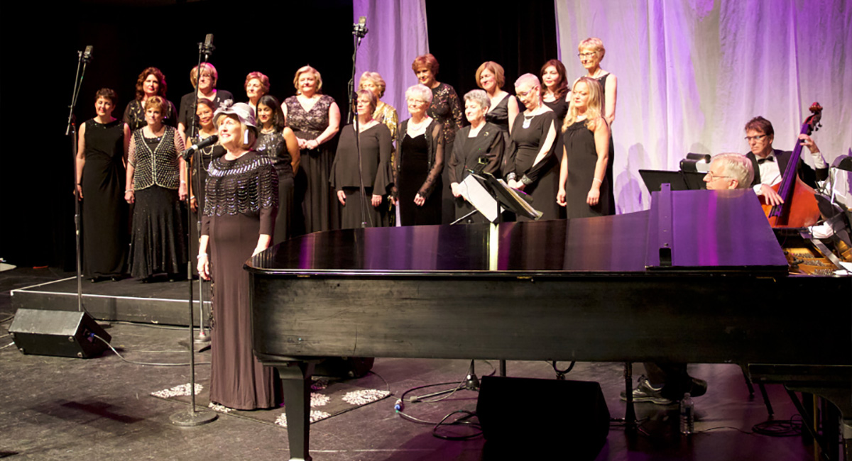 The Ambiance Singers performing on stage.