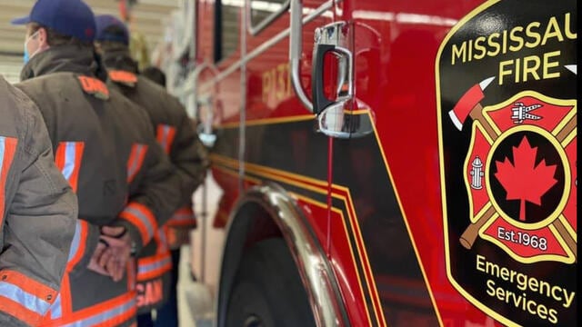 Close up view of the Mississauga Fire logo on a red fire truck.