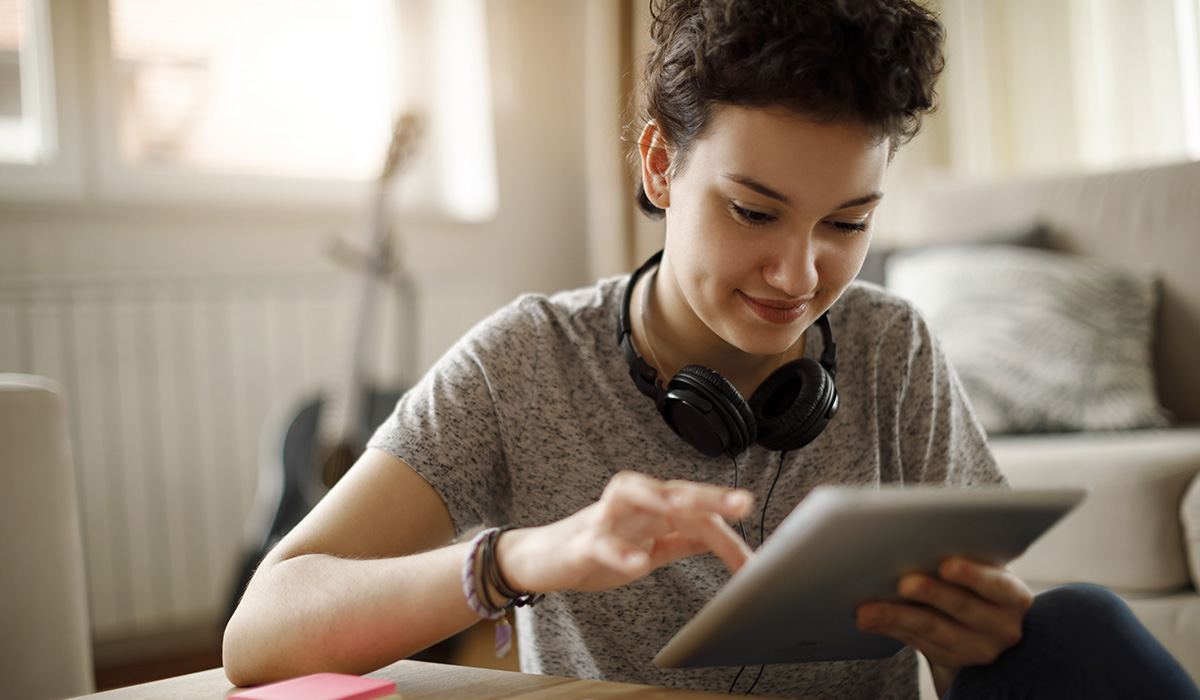 A teenager on a tablet device.