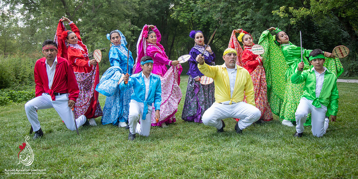 An group of performers on grass.