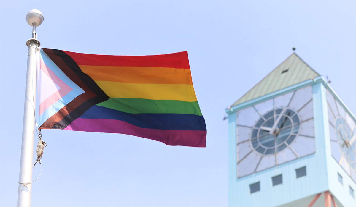 A rainbow flag waving