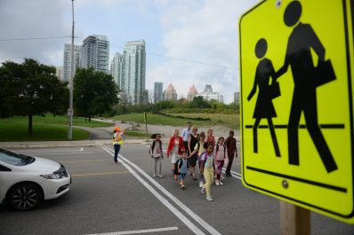 Image of children, Mayor Bonnie Crombie, Councillor Saito and Councillor Ras crossing street