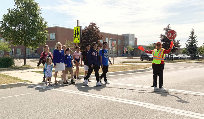 Mayor Crombie and children using crosswalk