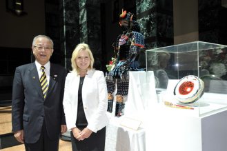 Mayor Crombie and Mayor Takenaka stand next to their gifts