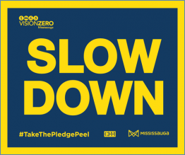Slow down in yellow text on a dark blue background
