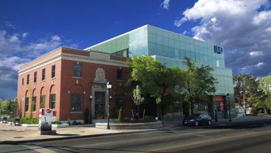 New glass building integrated with existing brick heritage building