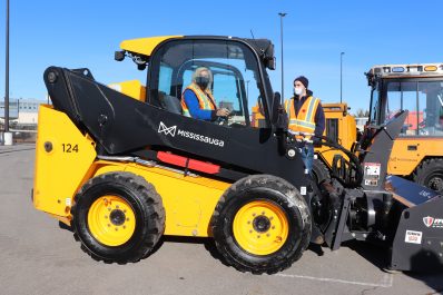Mayor Bonnie Crombie inside snow clearing equipment