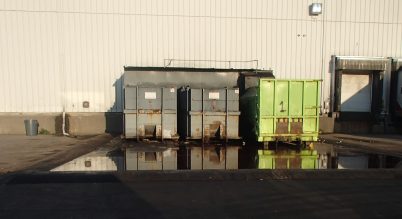 Example of outdoor waste storage containers at a business where leaks are properly contained and prevented from accessing the catchbasins on the property