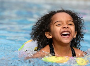 Child swimming in pool