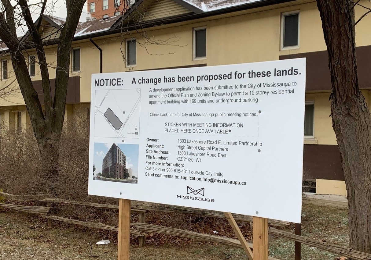 A City of Mississauga sign in front of a property that says "Notice: a change has been proposed for these lands". Includes details about the development application, owner, applicant, site address, file number and contact information. Also includes a map of the location and photo of the applicant's rendering.