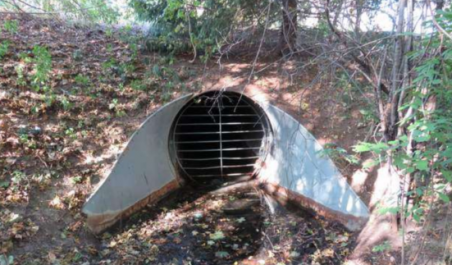Image of a culvert surrounded by dirt