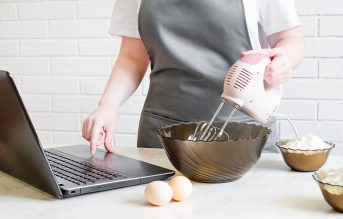 woman looking at recipes online while baking