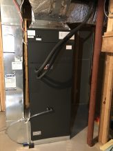 black heat pump unit indoors