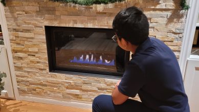 image of a child in front of a fireplace