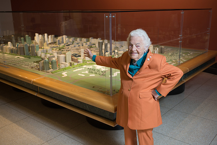Hazel McCallion, former Mississauga Mayor, pointing at a 3D model of the City of Mississauga.