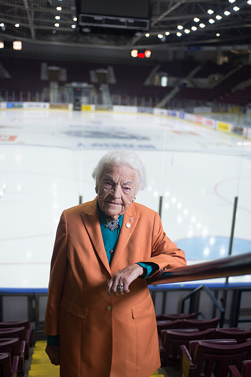 Hazel McCallion, former Mississauga Mayor, standing in front of an indoor ice rink.