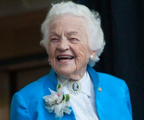 Hazel McCallion, former Mississauga Mayor, standing at a podium while delivering a speech.
