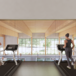 Women working out on treadmills overlooking a view of a pool through glass windows.