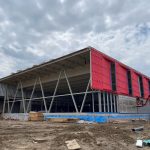 The exterior of a partially completed building.