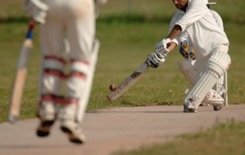 Three cricket players in a match 