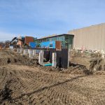 Construction workers on site at Carmen Corbasson Community Centre, working on the pool addition.