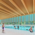 Artist rendering of people swimming in the new aquatics centre of the Carmen Corbasson Community Centre with large windows along the back that face a woodlot.