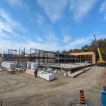 A construction site with a metal beam structure being erected.