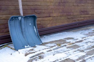 Snow shoveled away from foundation of home to help prevent flooding. 