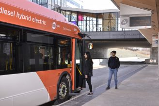PHOTO: Residents using a hybrid electric bus
