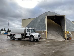 Brine truck in front of salt dome at Mississauga yard.