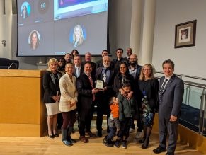 Group of people standing with award recipient