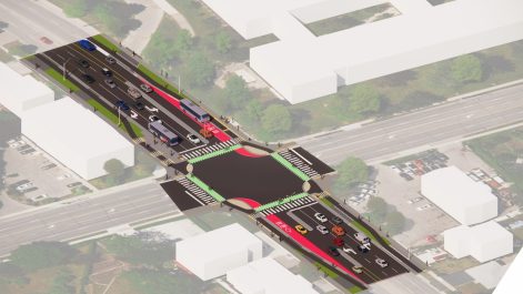 Overhead rendering example of how the intersection may be structured including crosswalks, separated bike lanes, and bus pull over lanes. 