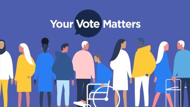 People standing in a line, holding signs that say "Your Vote Matters."