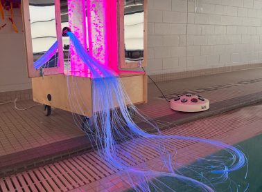 Snoezelen pool machine with sensory items, with a blue and hot pink colour display