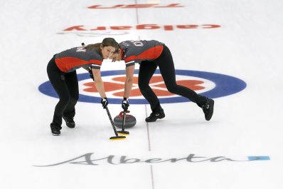 Image of two women curling.