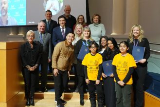 Group of people standing with their awards.