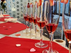 Row of glasses filled with red drink
