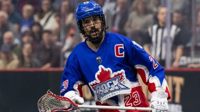 Close up of a person playing lacrosse