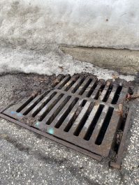 A cleared road drain.