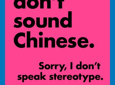 A pink poster that says "You don't sound Chinese." "Sorry, I don't speak stereotypes."